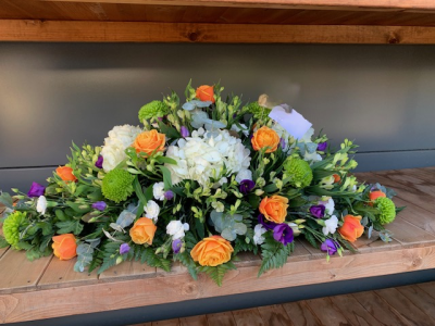 Casket Spray Orange Green White And Purple - Casket Spray With Orange Roses White Hydrangea Green Blooms And Purple Lizianthus